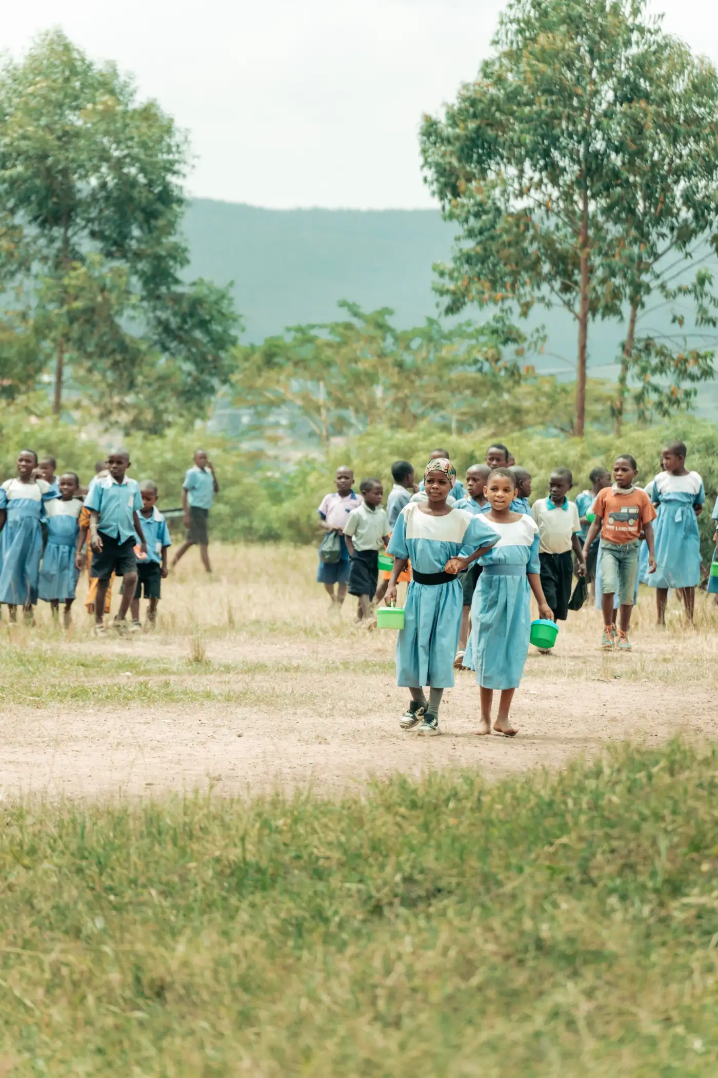 Children in school uniforms walking to school